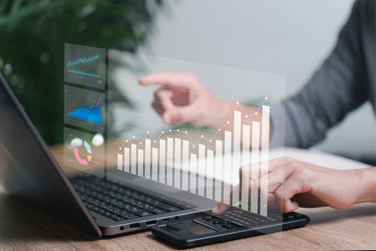 A person sitting in front of a laptop looking at how inbound marketing is increasing sales through the inbound marketing funnel.