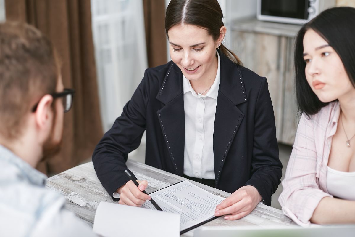 A sales person going over a contract with a potential customer.