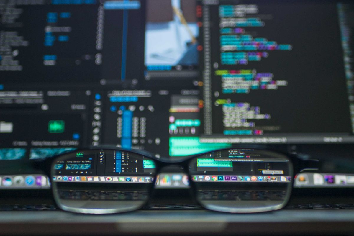 A pair of glasses placed in front of a screen where a SaaS product is visible.