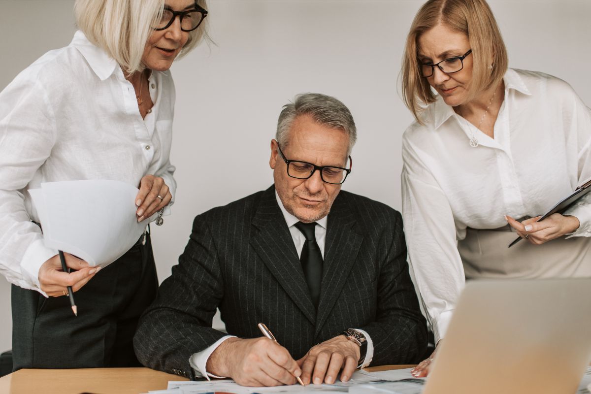 How to Outsource SEO An executive signing of the outsourcing of SEO in their company.